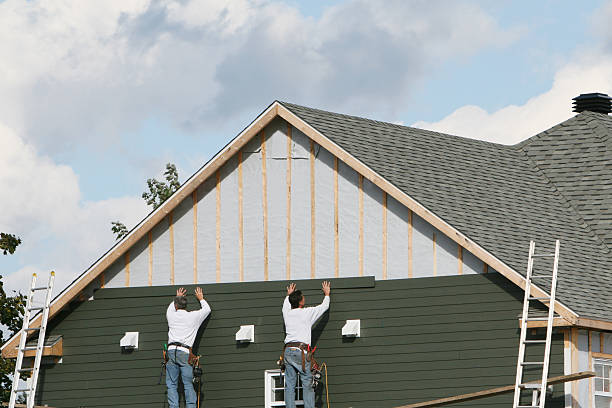 Professional Siding Installation technician working in Adamsville, TN